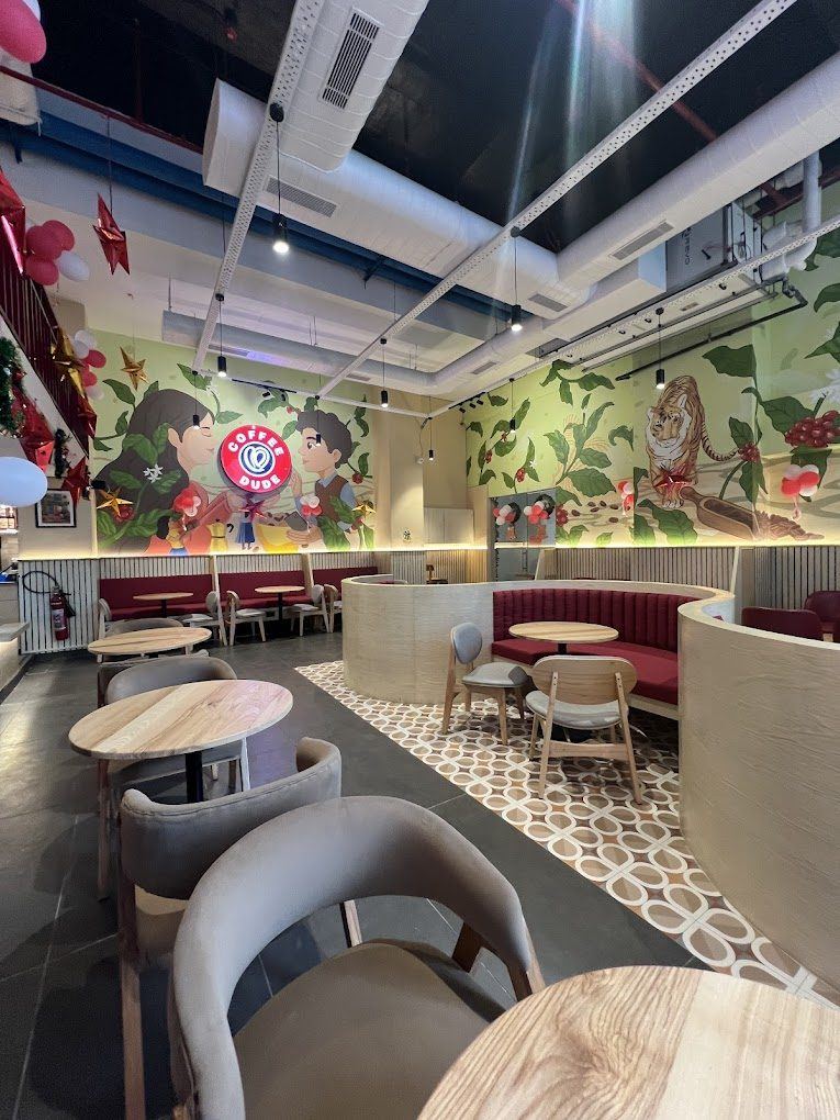 Painted mural and seating at Coffee Dude Noida Sector 62
